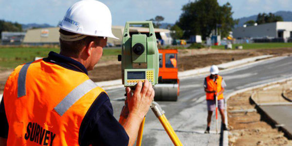 RLS surveyors working in the field with surveying equipment